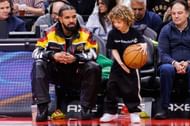 Rapper Drake plays with his son Adonis during the second half of the NBA game between the Toronto Raptors and the LA Clippers at Scotiabank Arena on December 27, 2022, in Toronto, Canada. (Photo by Cole Burston/Getty Images)